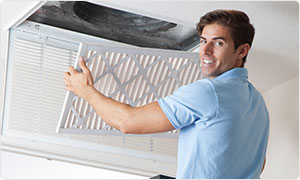 man with air conditioning filter